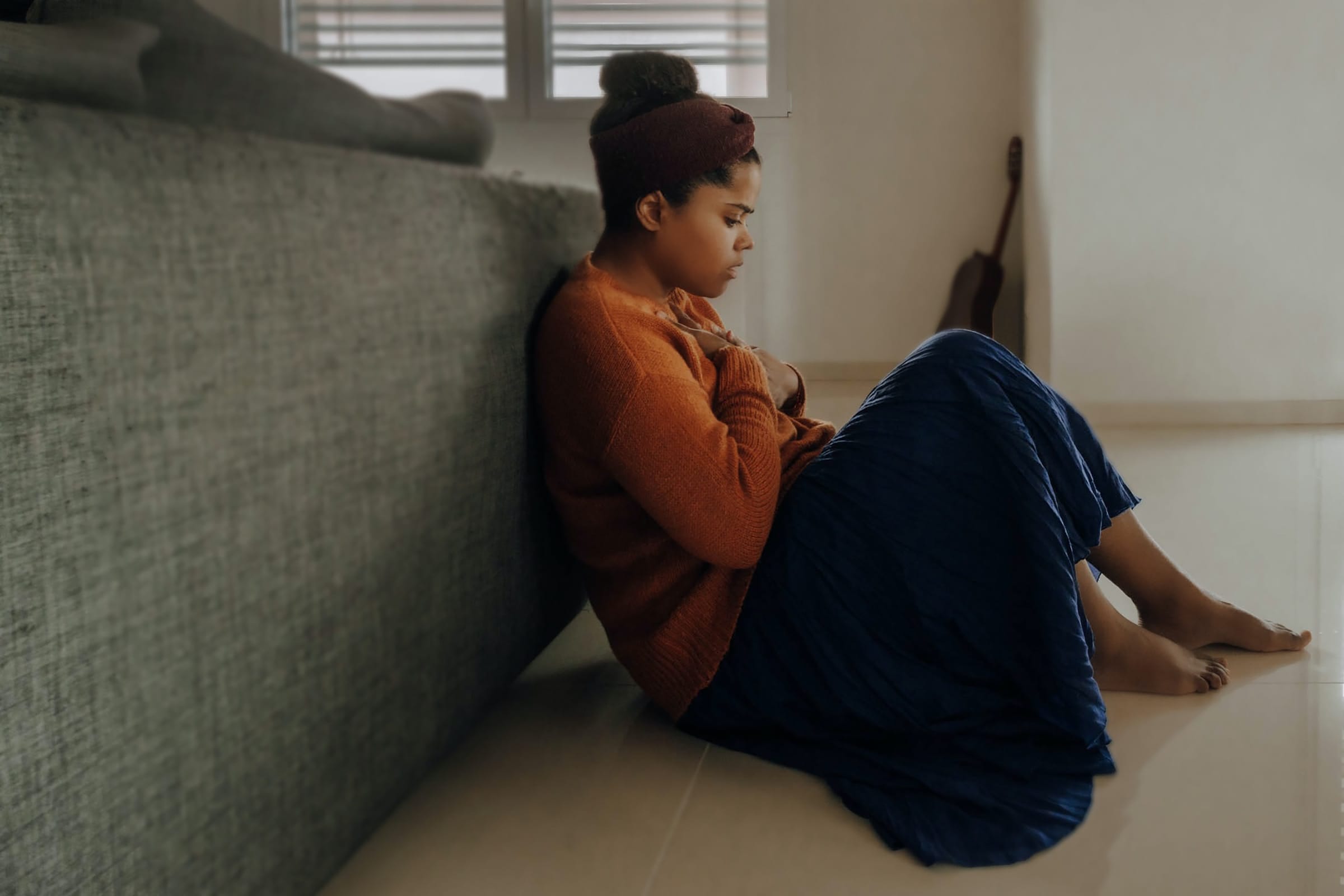 women sitting on the floor at home