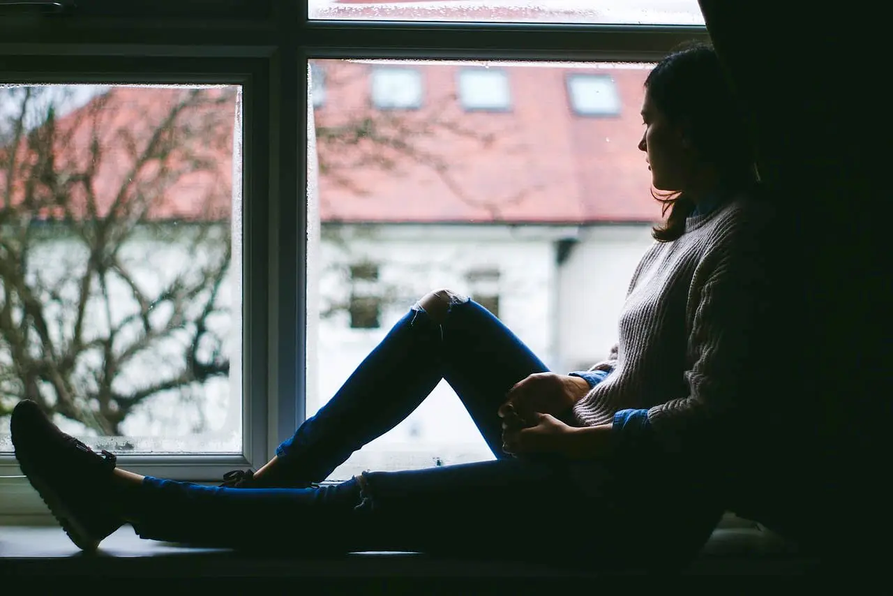 girl wating outside from window
